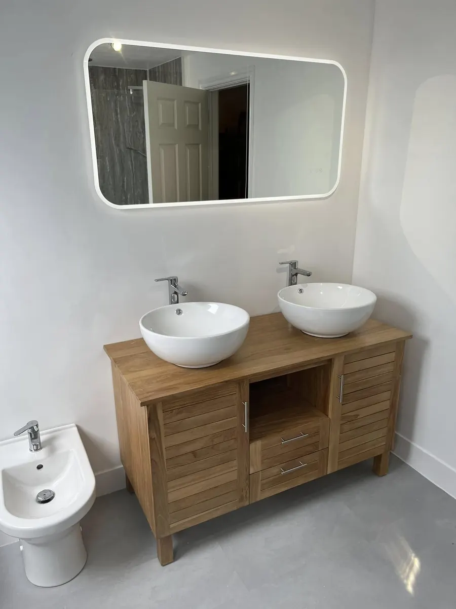Teak double vanity unit with twin countertop basins, LED mirror and bidet